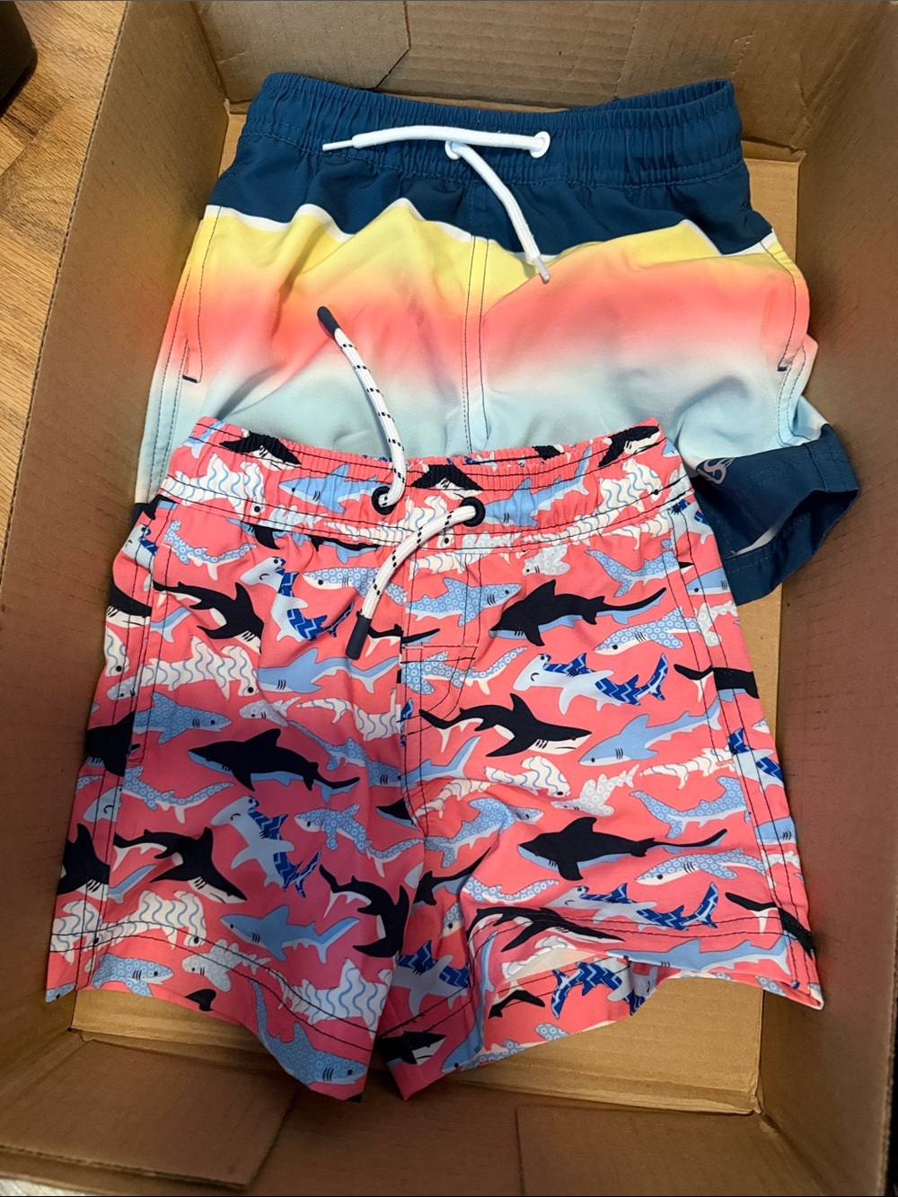4 pair kids bathing suit bottoms and 1 swim shirt